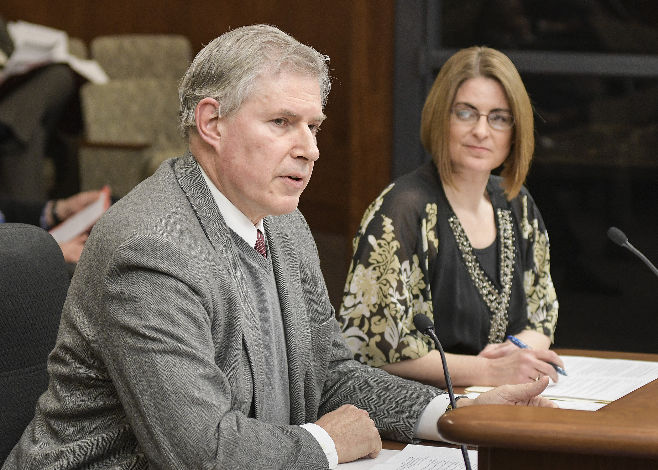 Rick Evans, regional government affairs director at Xcel Energy, testifies before the House Job Growth and Energy Affordability Policy and Finance Committee April 16 in support of a bill sponsored by Rep. Marion O’Neill, right, that would establish a carbon reduction facility designation for large electric generating facilities. Photo by Andrew VonBank